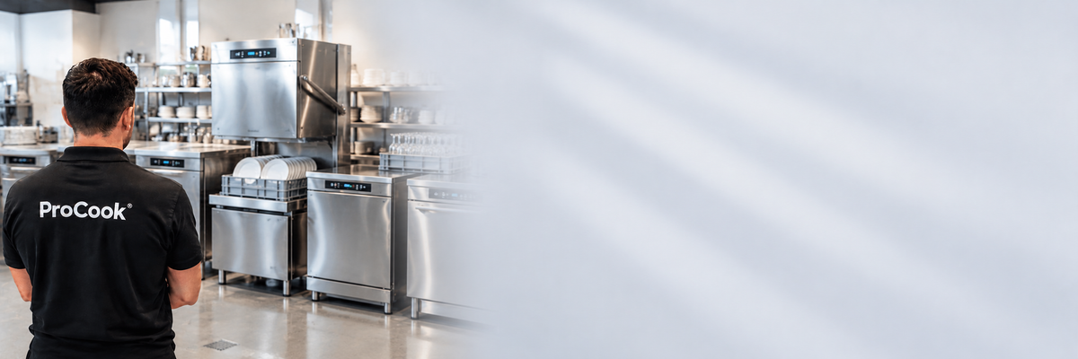 A man wearing a black ProCook t-shirt stands with his back to the camera in a commercial kitchen, looking toward stainless steel appliances. The right side of the image features a large, soft-focus white overlay.