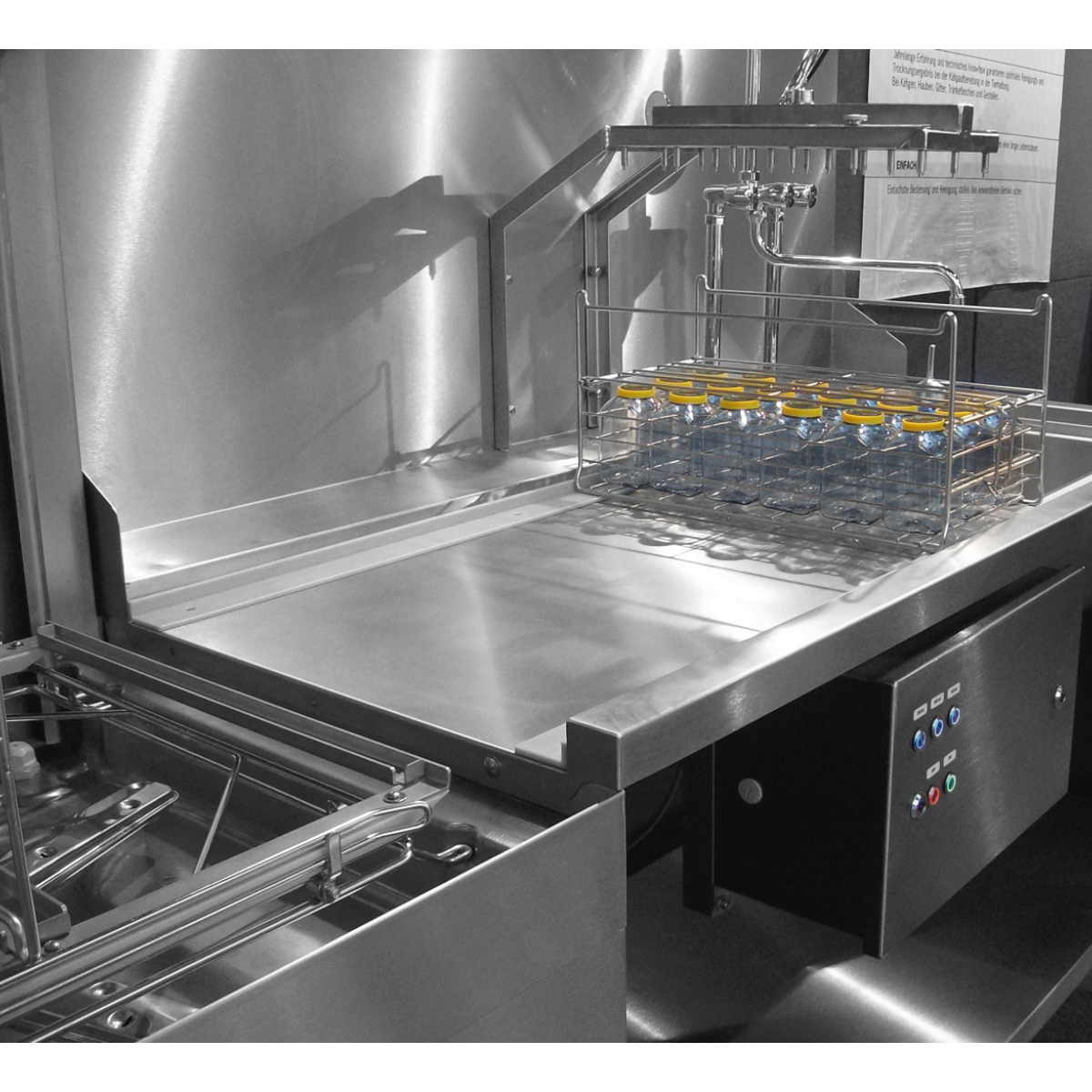 Hobart Profi AMXT Double Rack Passthrough Glass & Dishwasher | Dishwashers Direct with a wire basket holding several small bottles, photographed in a clean industrial setting.