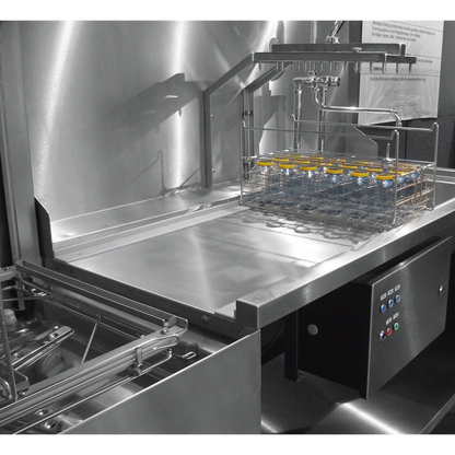 Hobart Profi AMXT Double Rack Passthrough Glass & Dishwasher | Dishwashers Direct with a wire basket holding several small bottles, photographed in a clean industrial setting.