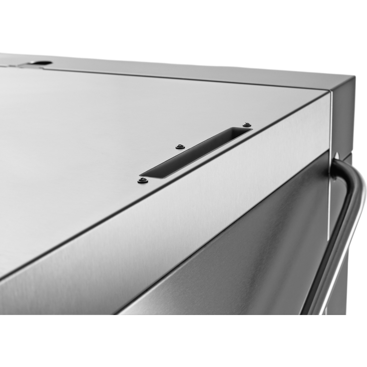 Close-up detail of Hobart Profi AMXXL Passthrough Dishwasher 500mm Rack | Dishwashers Direct corner with a brushed metal surface, a recessed handle opening, and a dark handle edge visible against a white background.